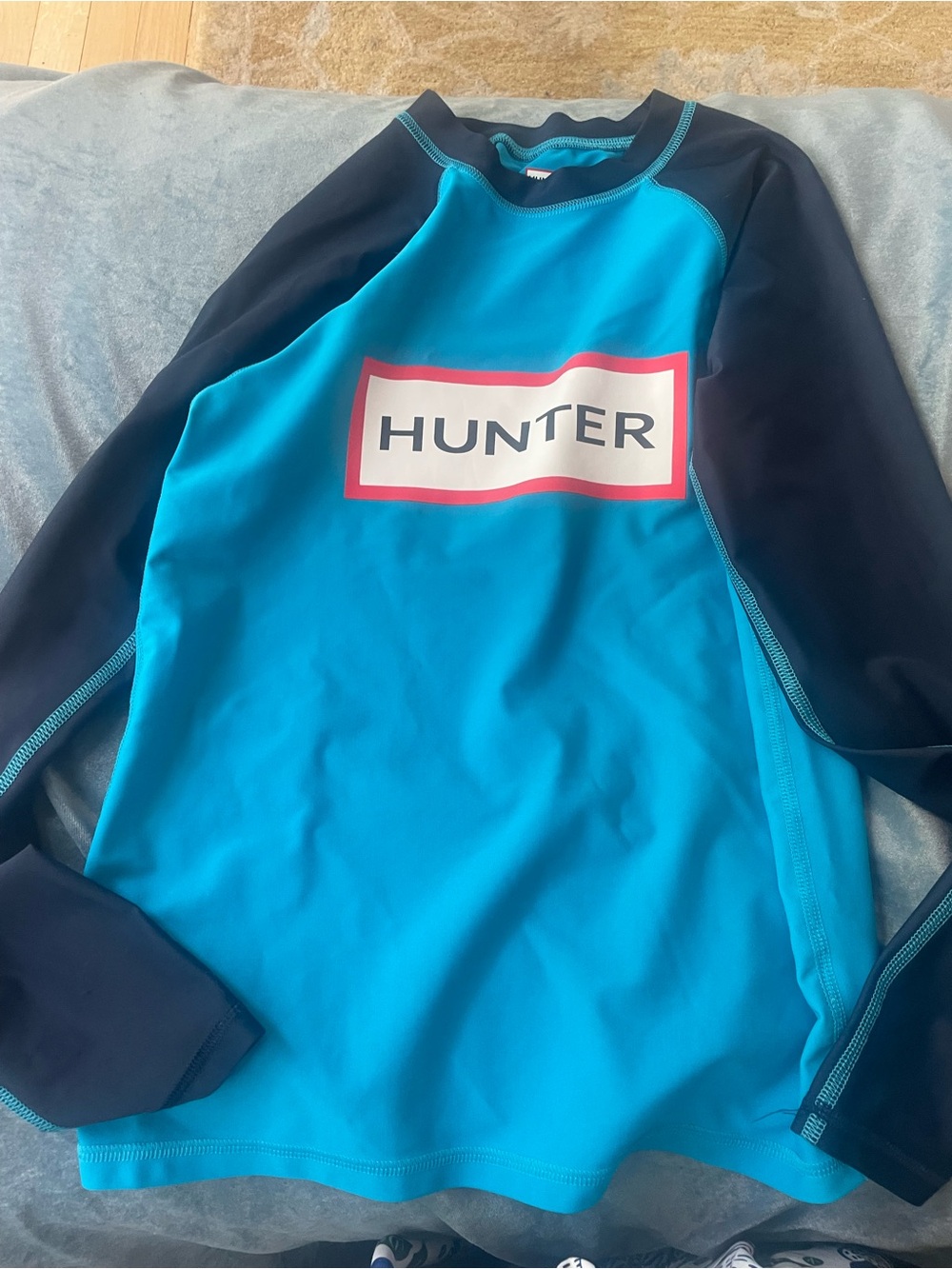 Hunter Kids Long Sleeve Rashguard in Bright Blue and Navy with Red Logo Trim